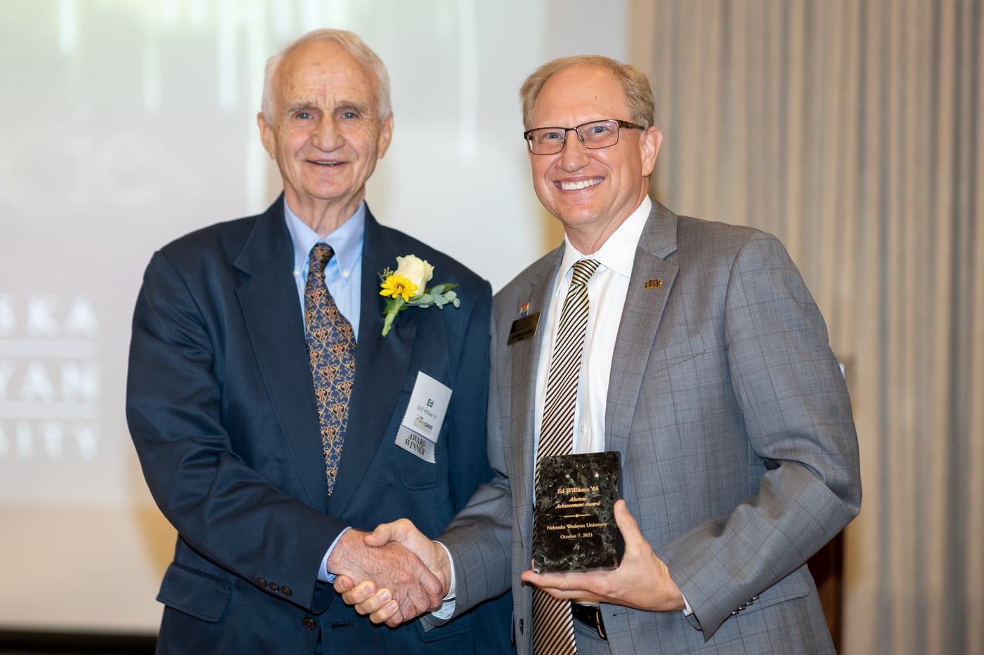 Award handshake, Wesleyan gala, documentary.