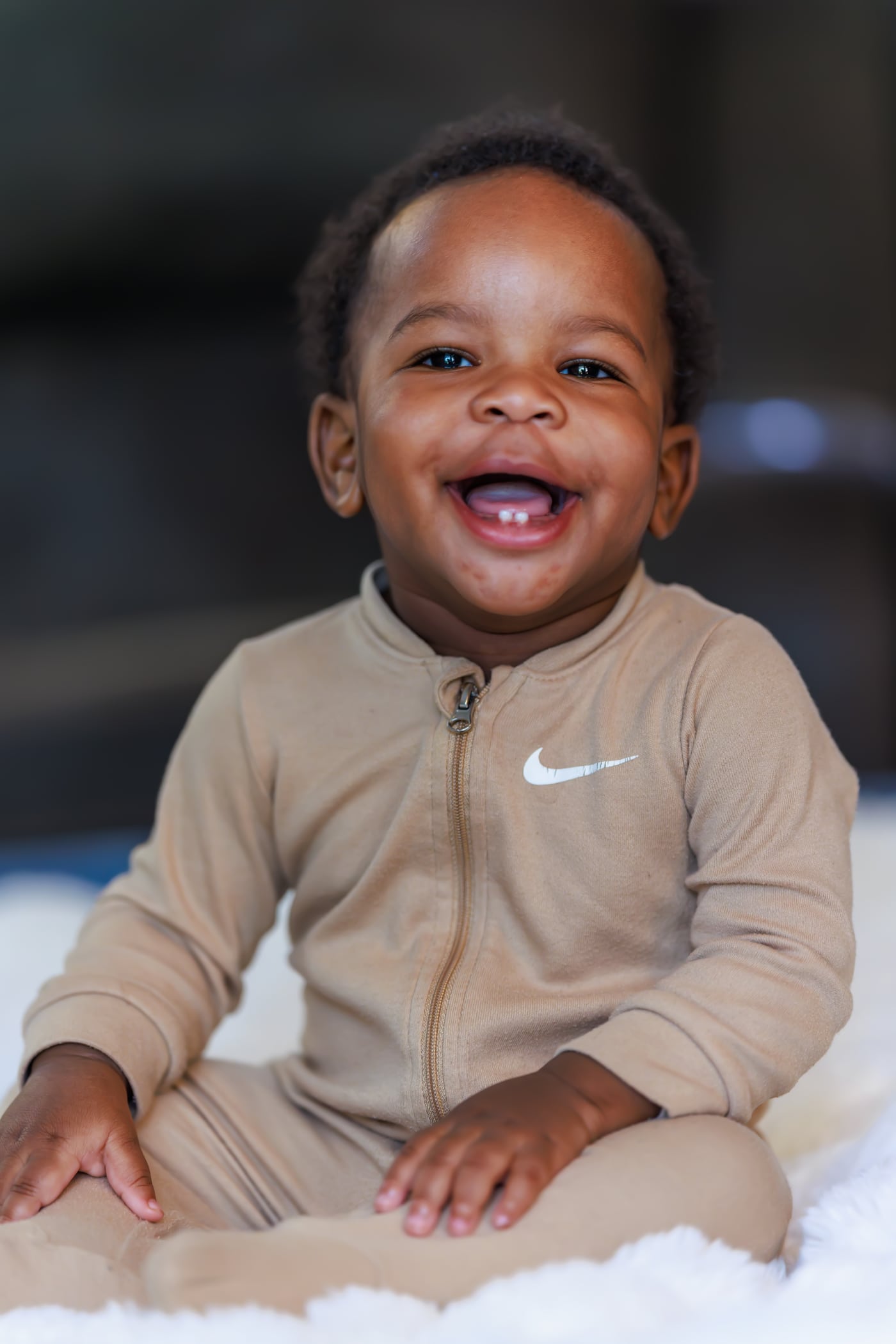 Baby tan outfit, big laugh, children.