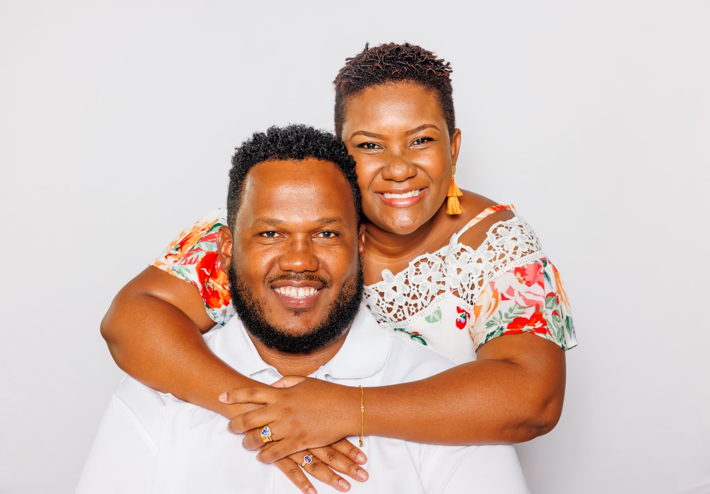 Couple + kids, floral/white, joyful, family.