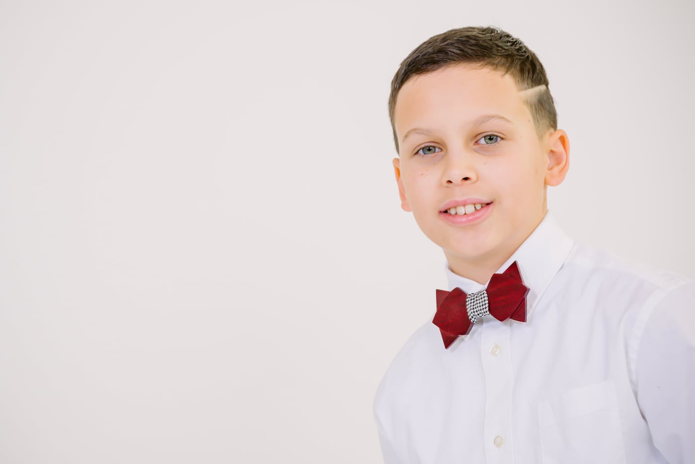 Boy white shirt + red bowtie, studio, formal children.