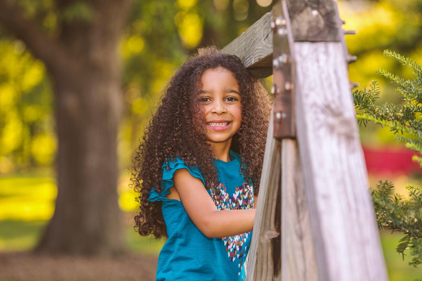 Little girl teal dress, park, smiling, children.