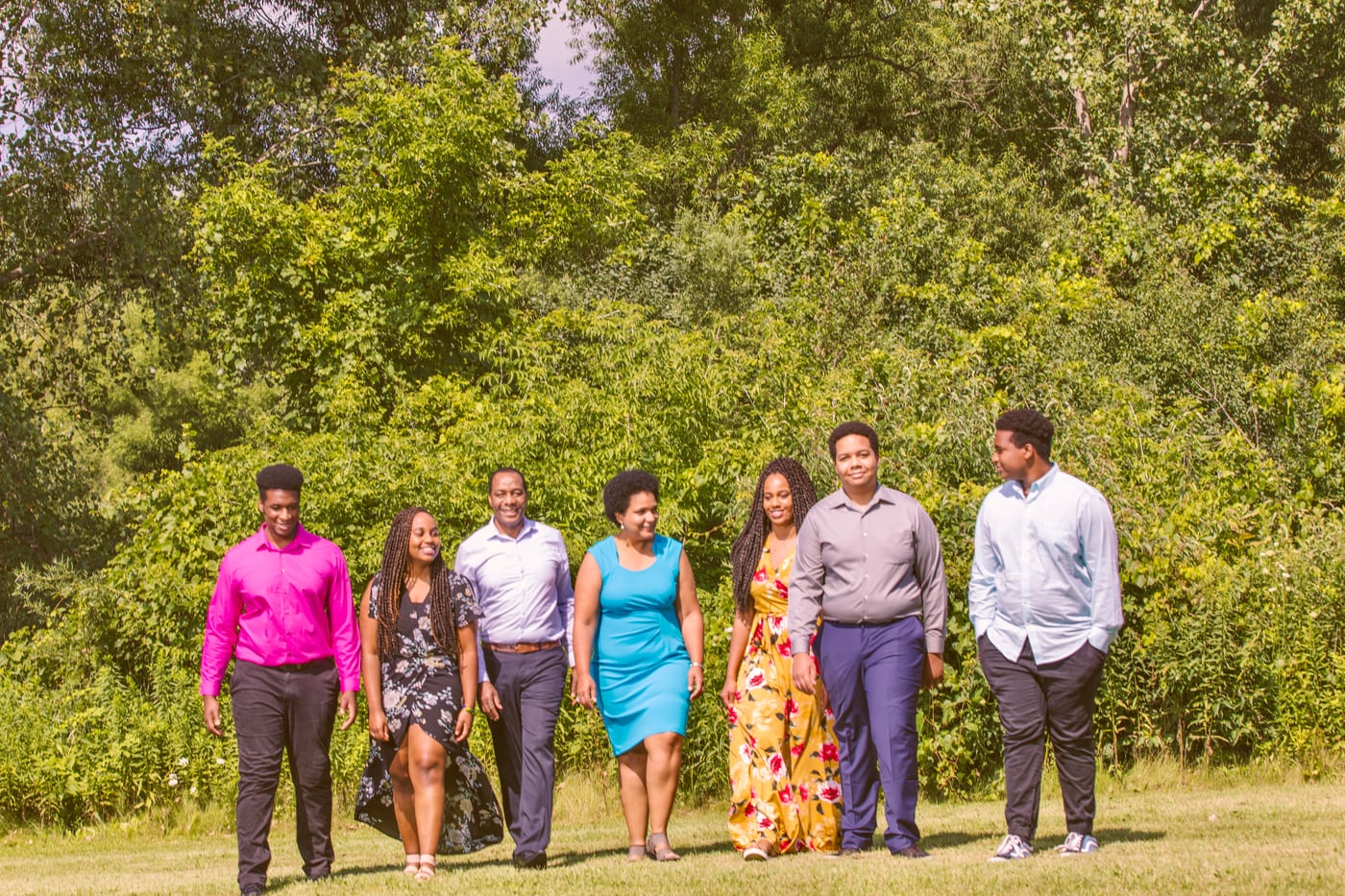 Large family group, colorful field.