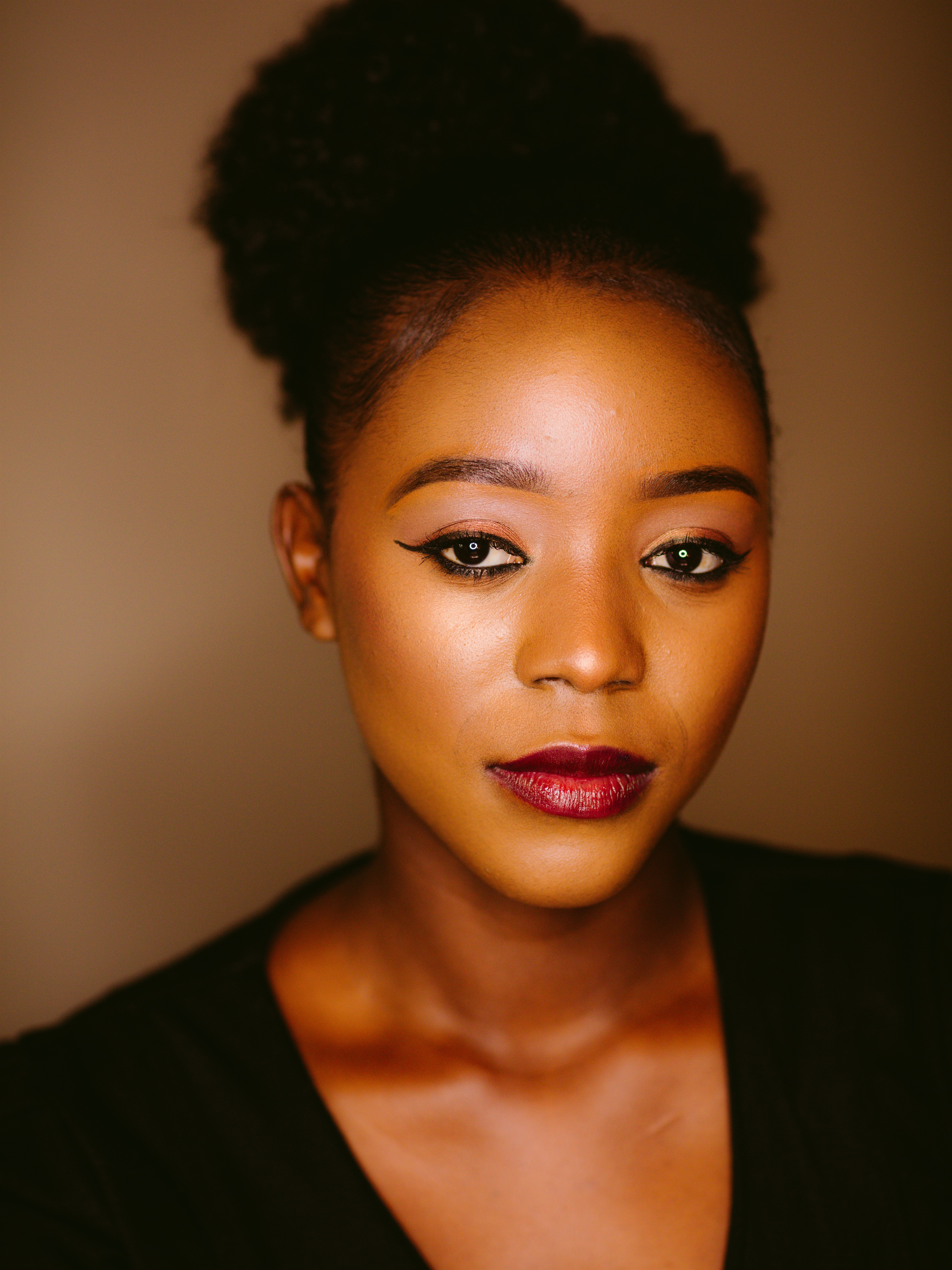 Premium beauty portrait closeup with warm editorial finish.