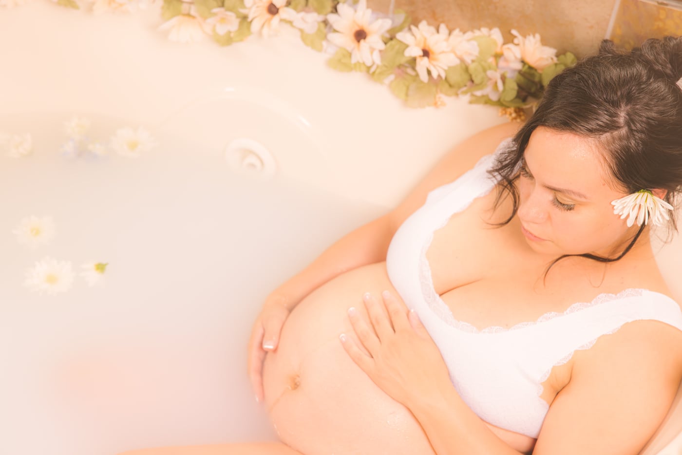 Milk-bath maternity with florals, distinct look.
