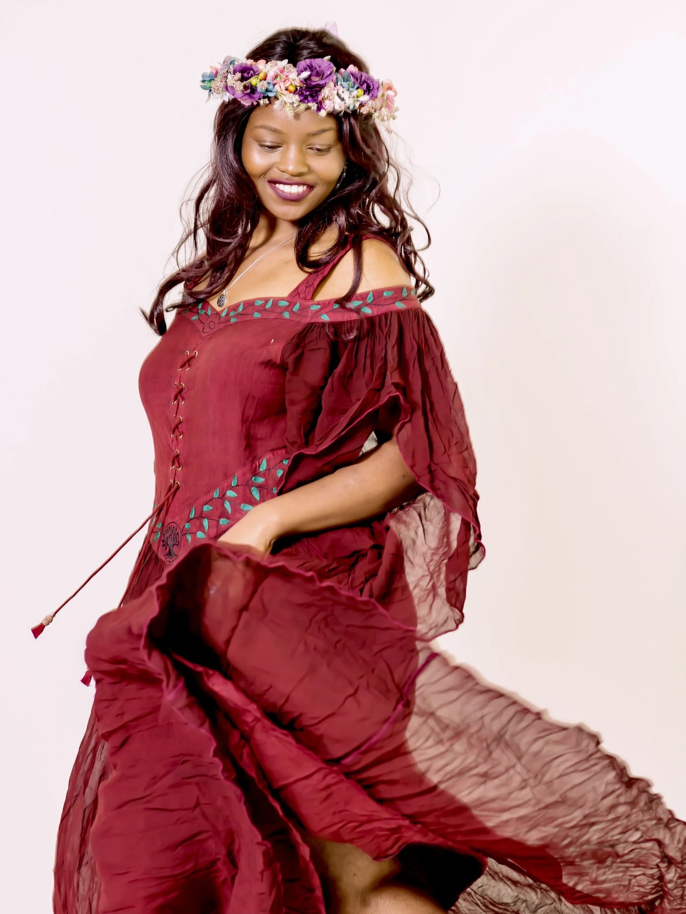 Red gown flowing, studio, striking maternity.
