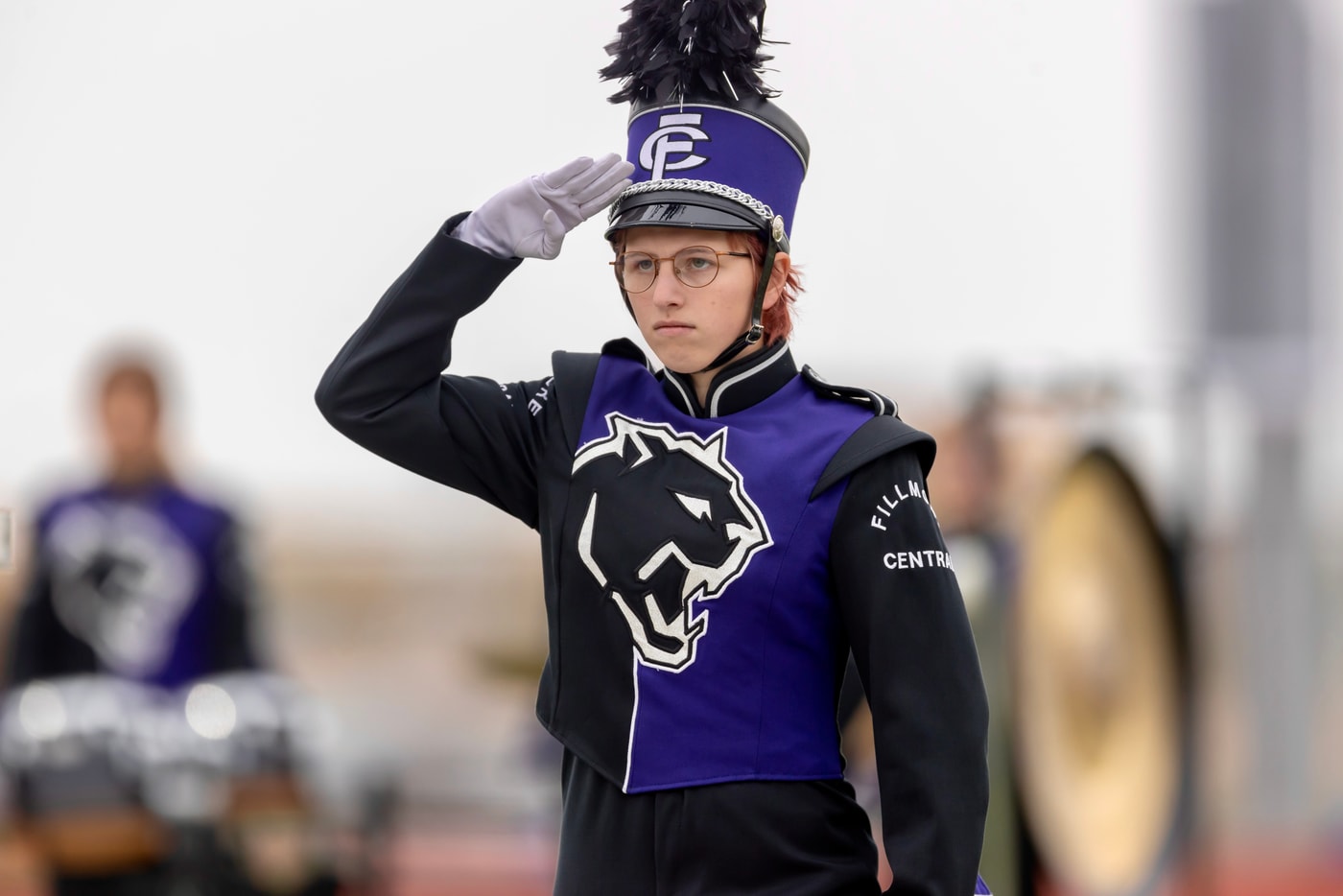 Marching band salute, performance coverage.