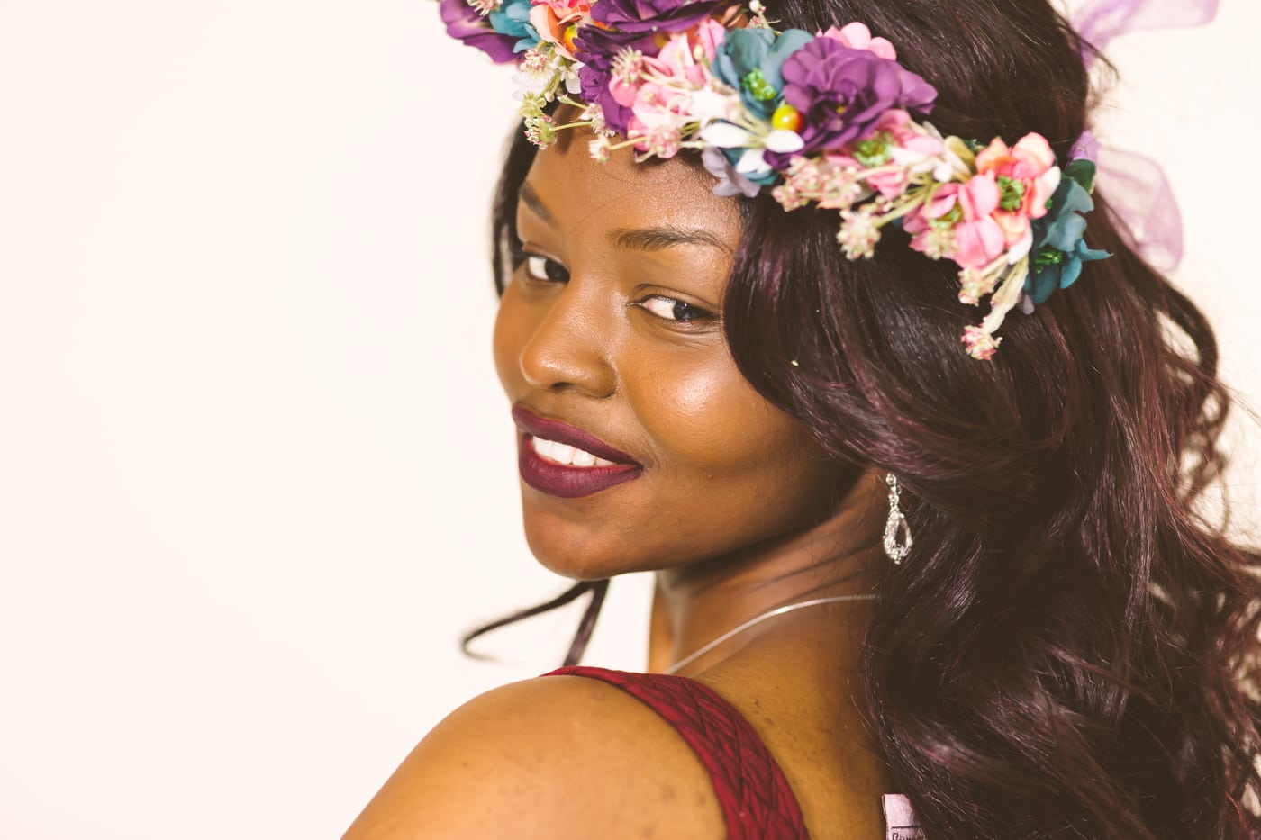 Woman floral crown, warm beauty, editorial.