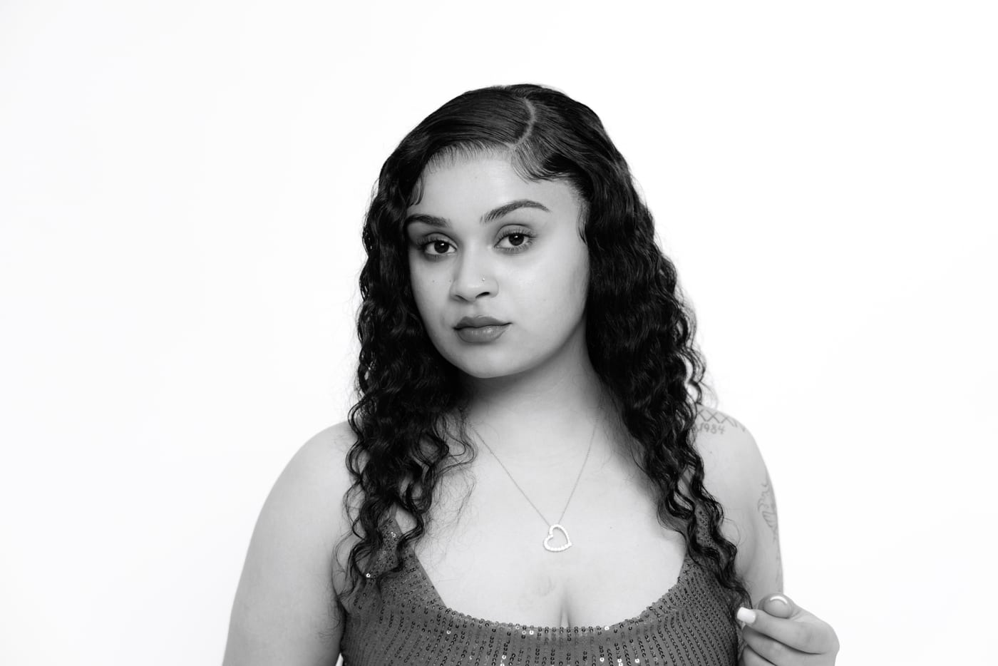 Woman B&W curly, white bg, elegant beauty.