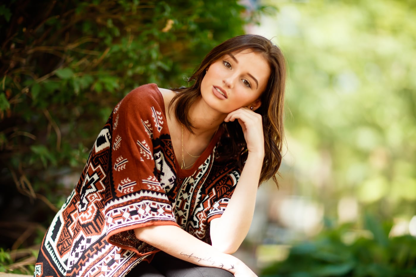 Boho brown, forest bokeh, mid-laugh.