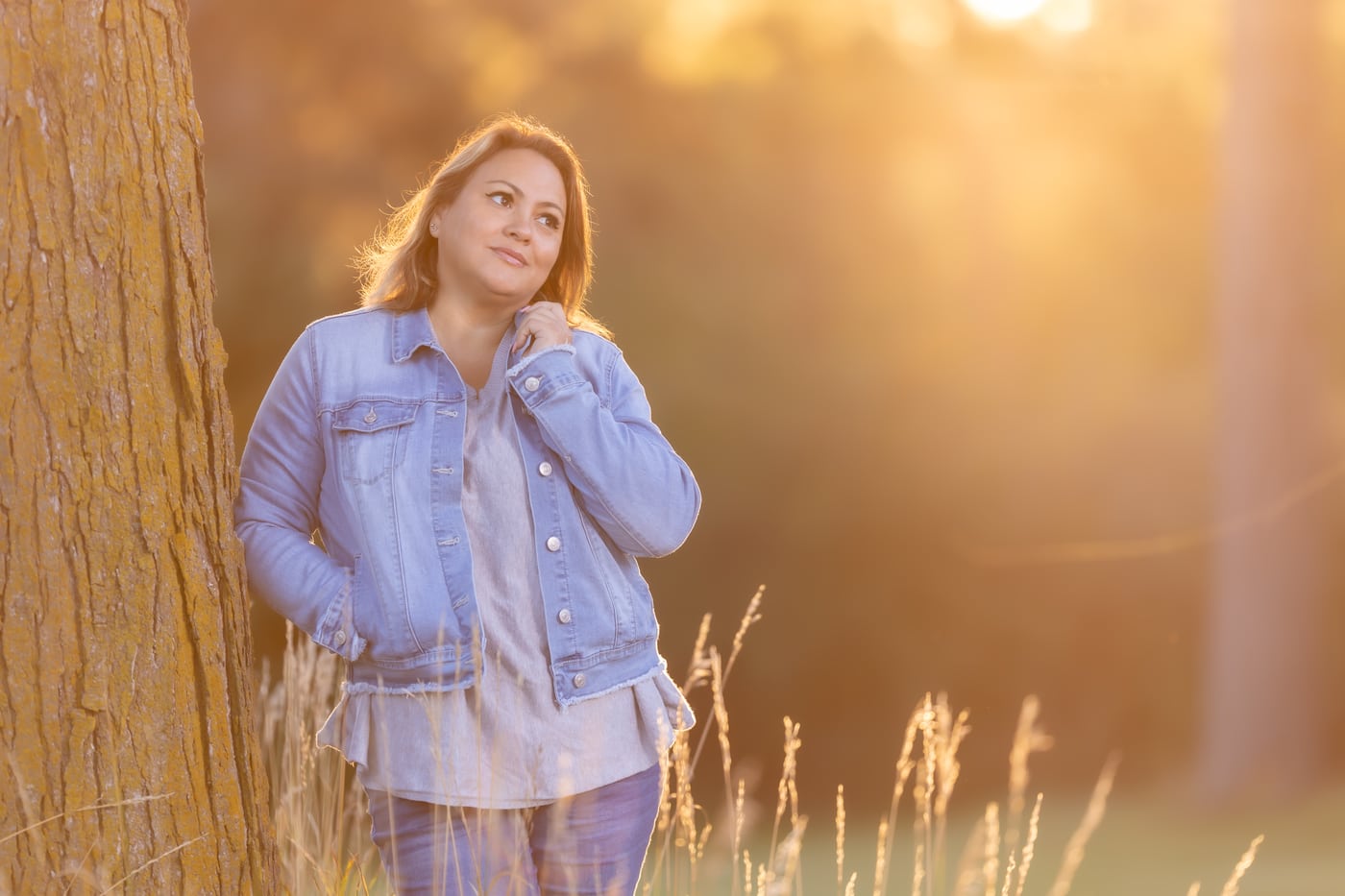 Denim jacket, backlit golden field.