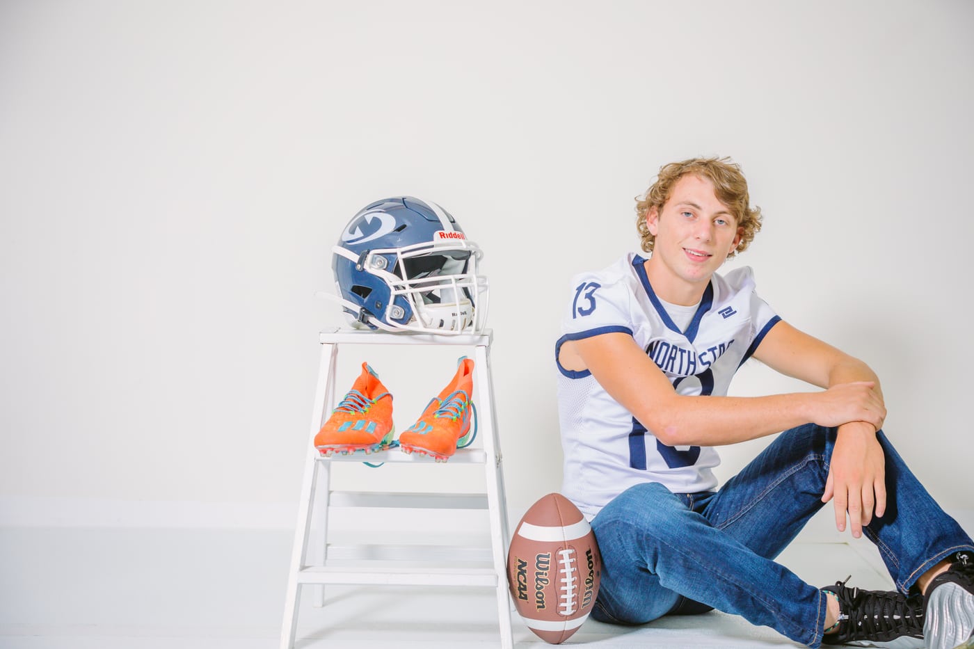 Senior football boy, helmets on ladder, white, sports senior.