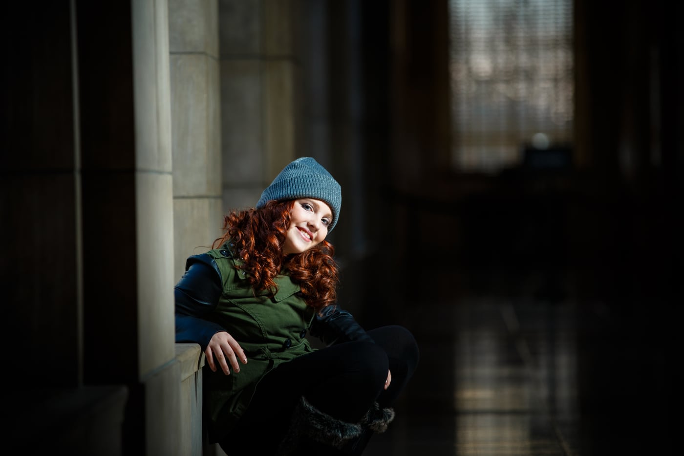 Redhead beanie, moody corridor.
