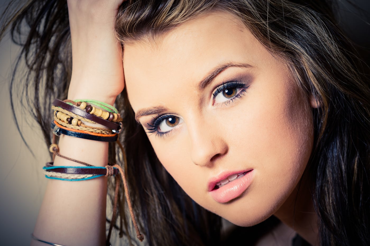Senior beauty close-up, bracelets, polished.