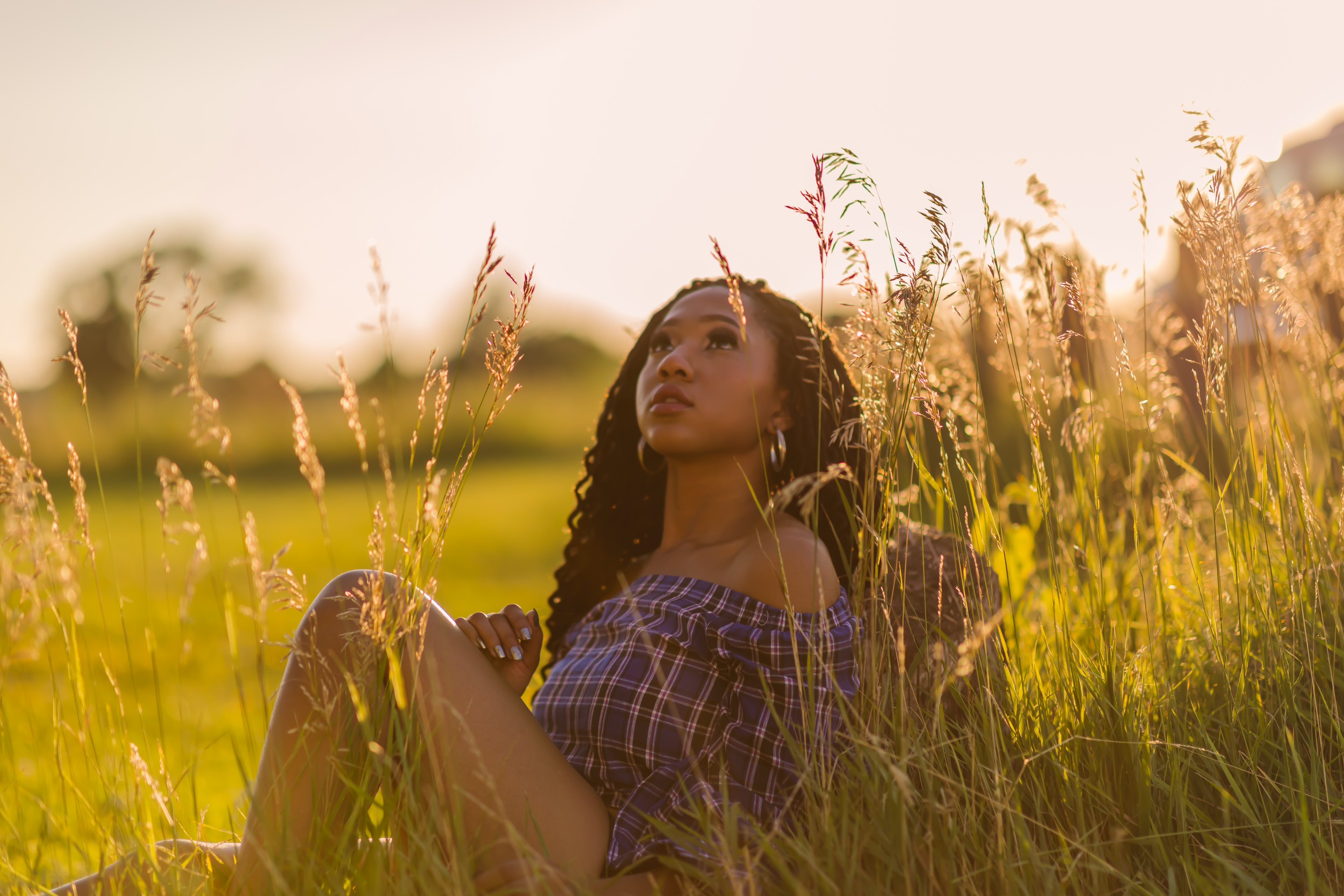 Senior portrait in golden field.