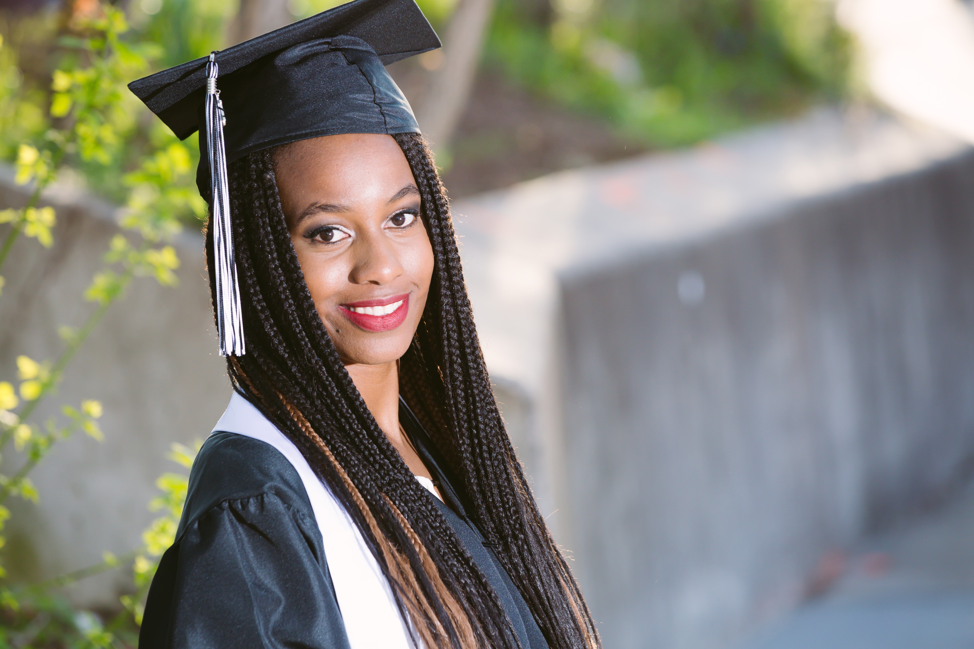 Cap and gown senior portrait.