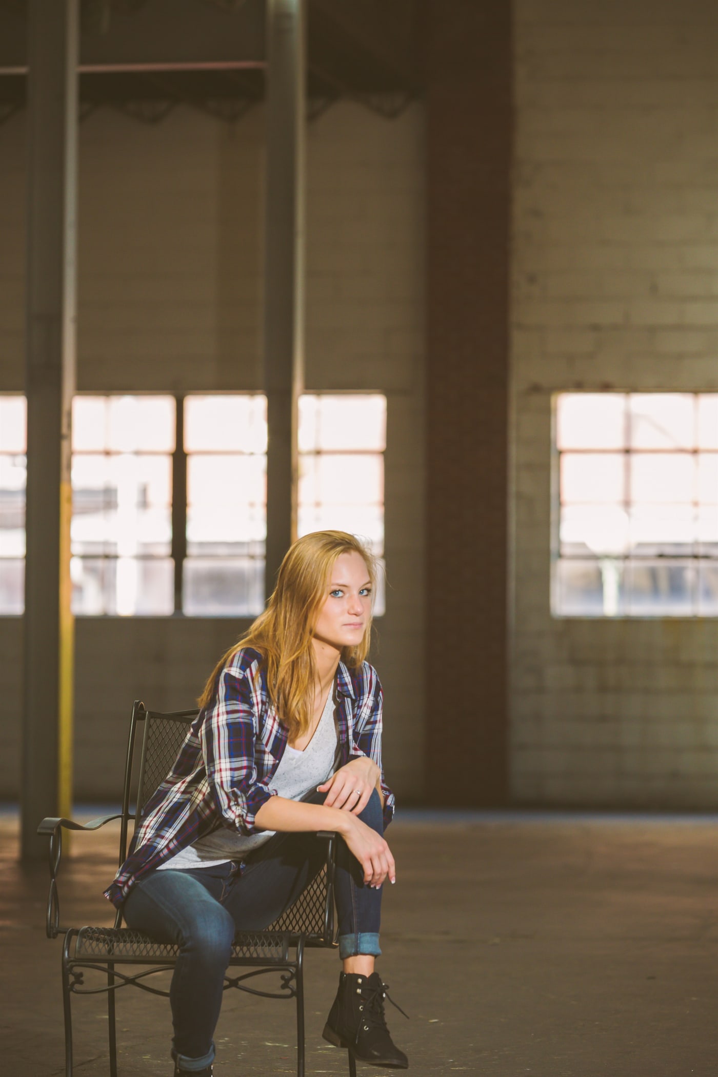 Urban senior portrait in industrial setting.