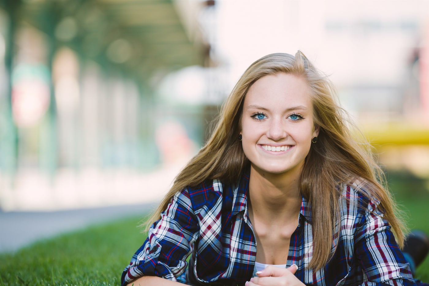 Soft smiling senior portrait with shallow depth of field.