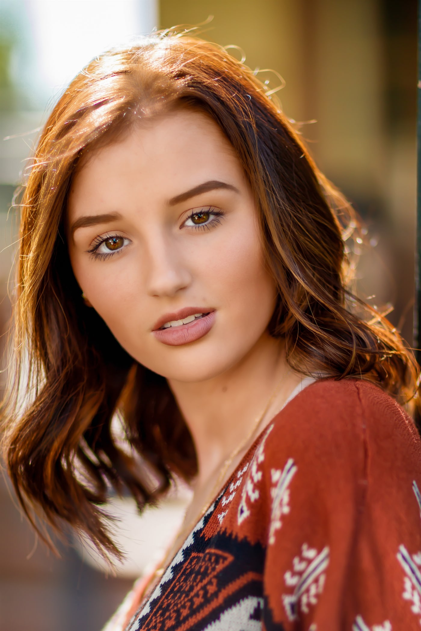 Editorial senior portrait with warm close crop.
