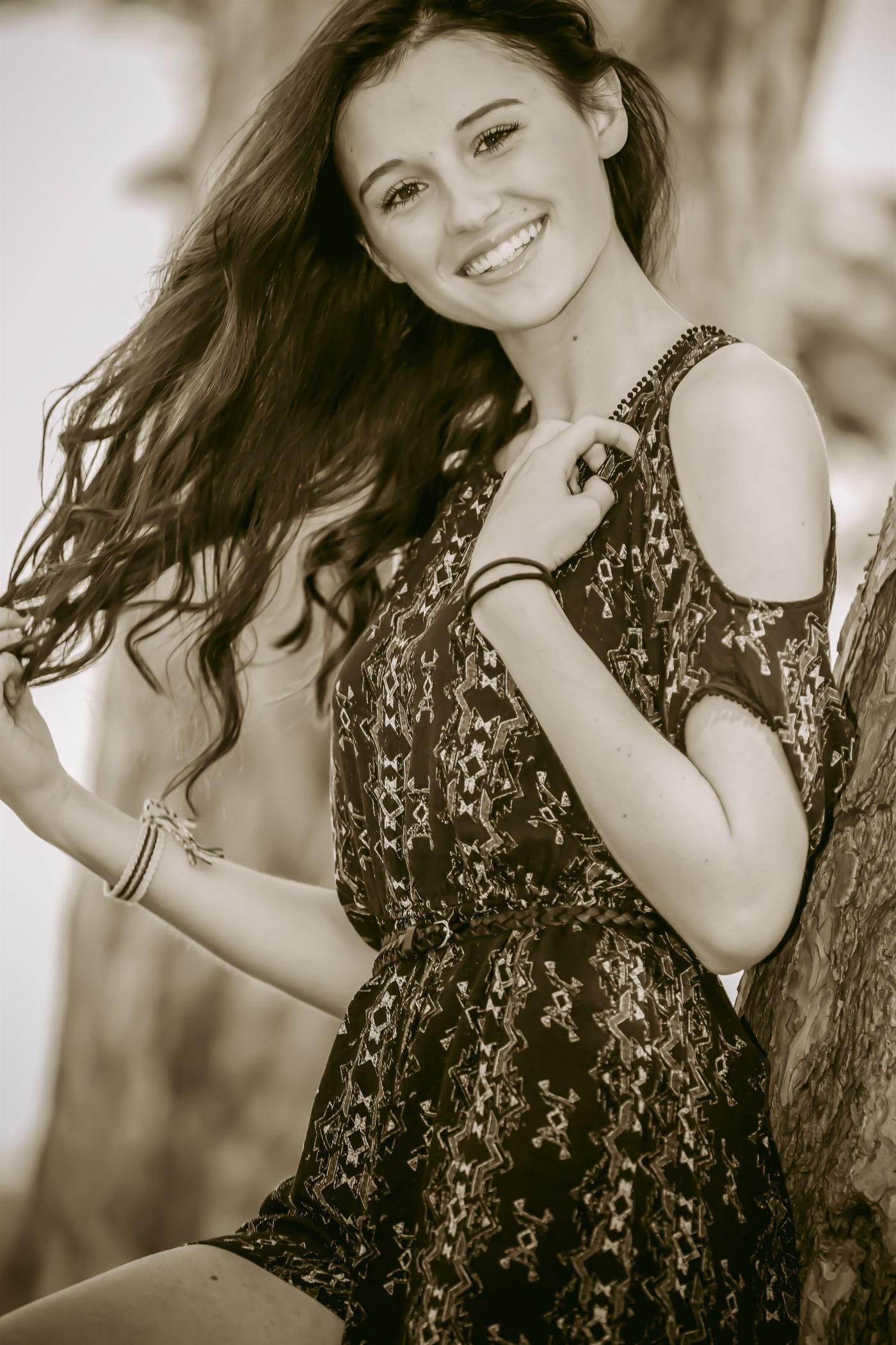 Black-and-white senior portrait with natural movement.
