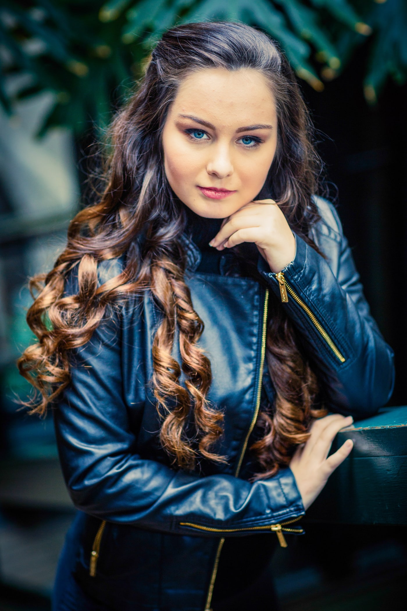 Senior portrait with leather jacket and urban styling.