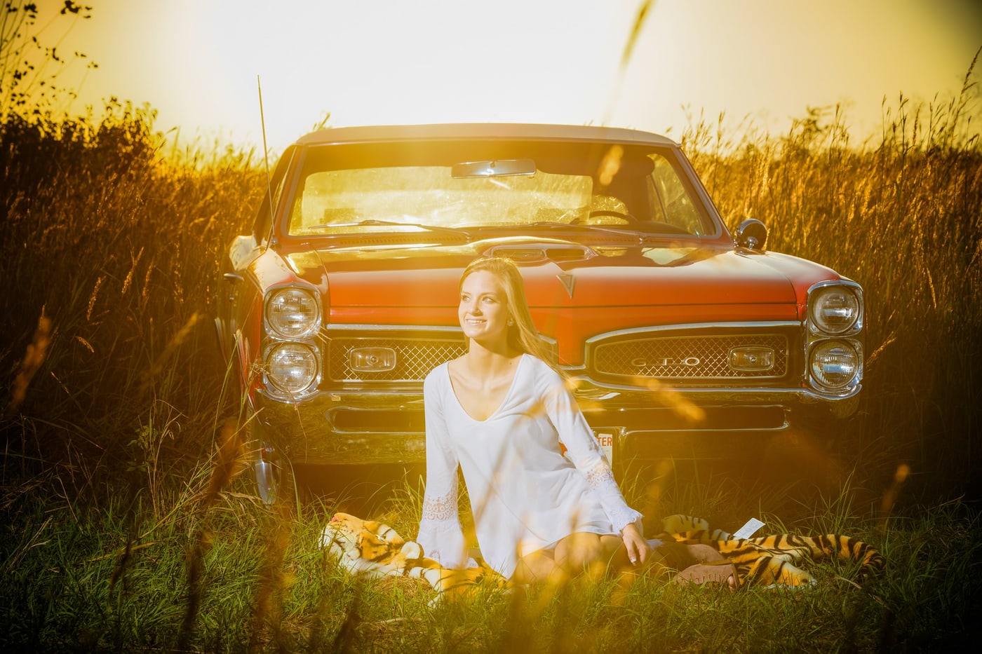Classic truck senior portrait with golden flare.