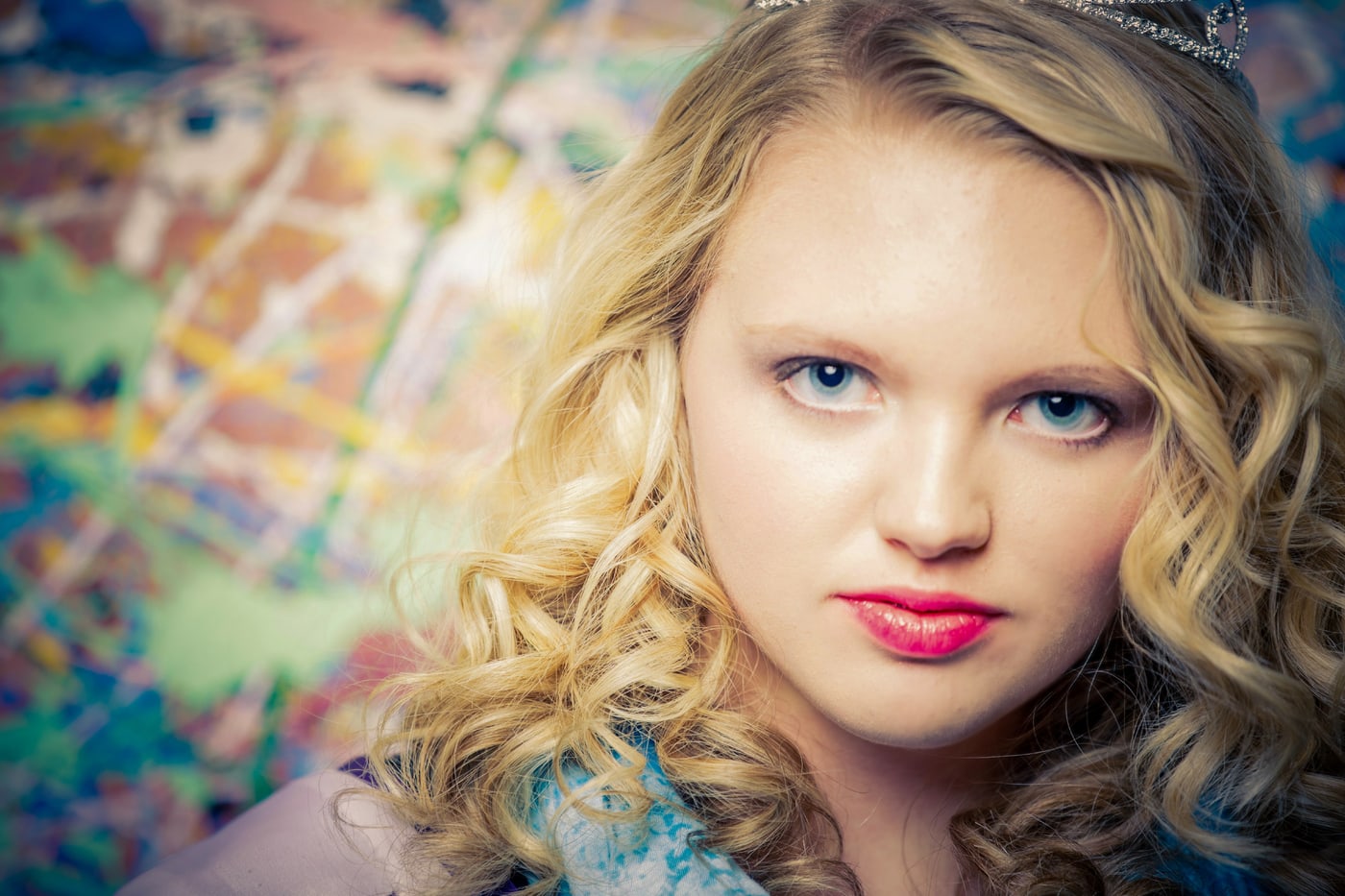 Close senior beauty portrait with bold eyes.