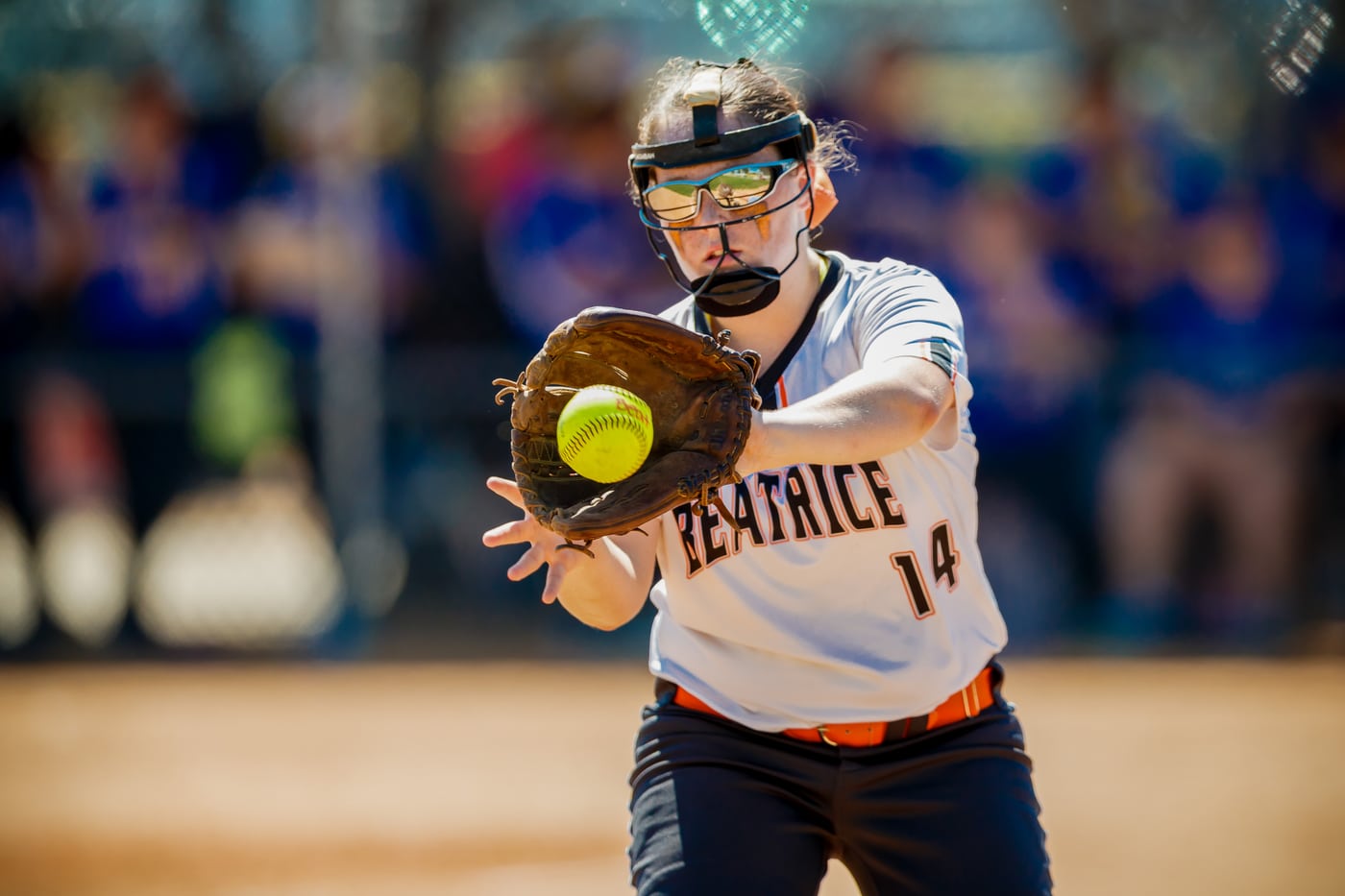 Softball Beatrice #14 catching, action.