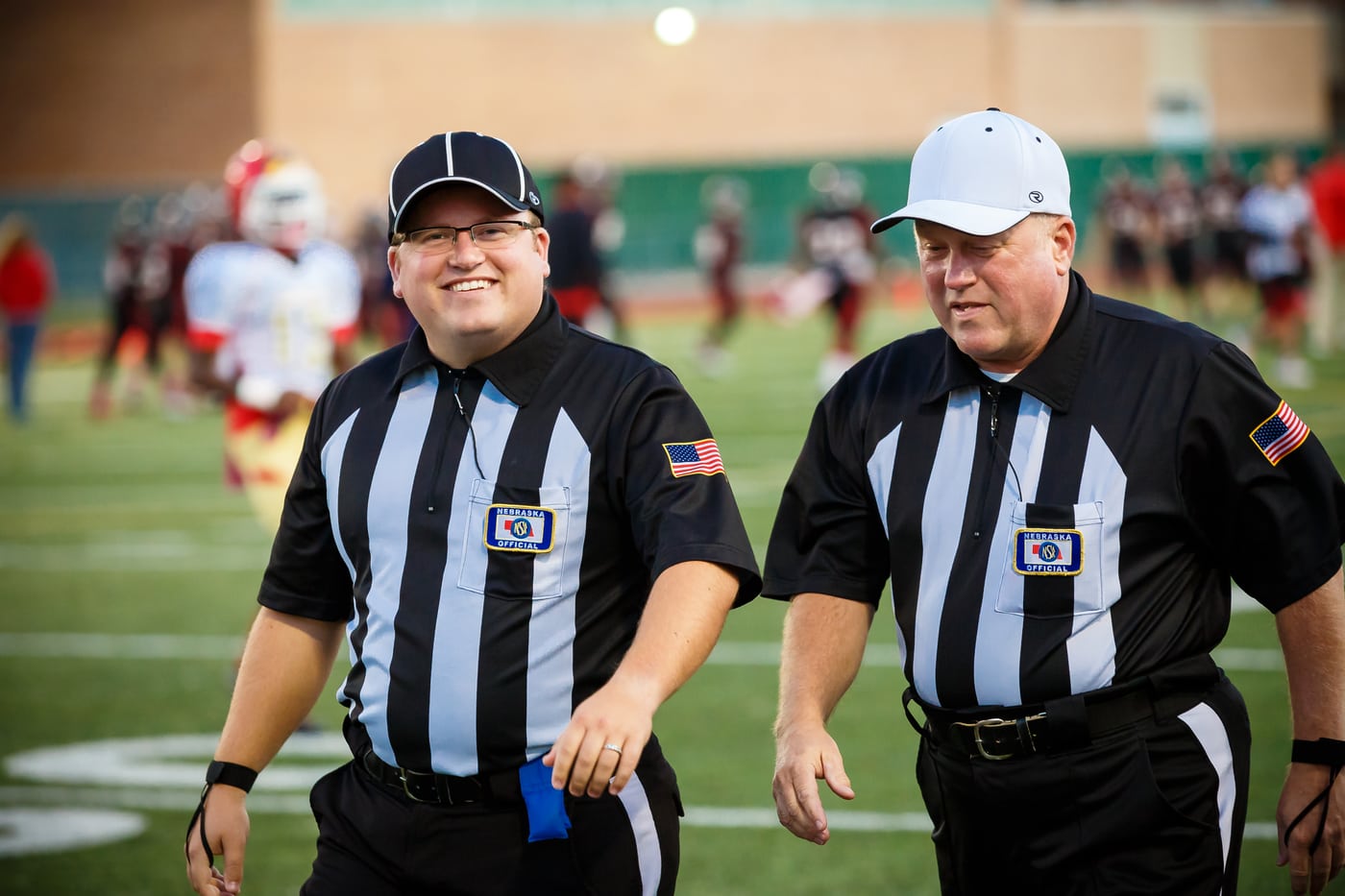 Two referees walking, documentary.
