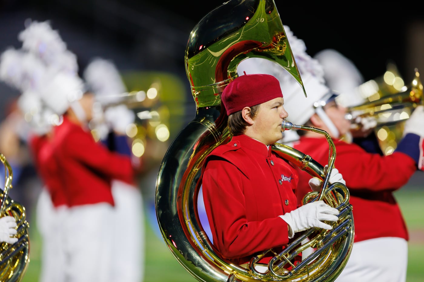 Marching band sousaphone, red uniform.