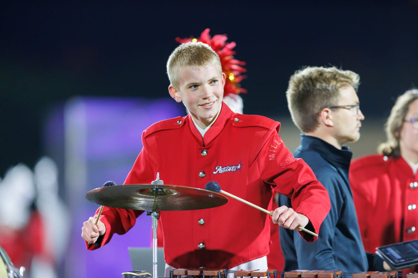 Drummer red uniform, cymbals, day, band.