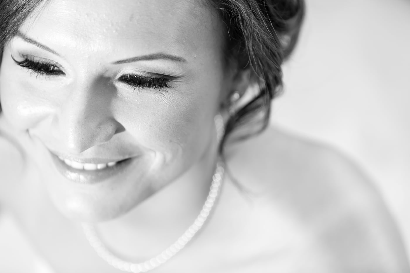 Bride B&W eyes closed, serene beauty.