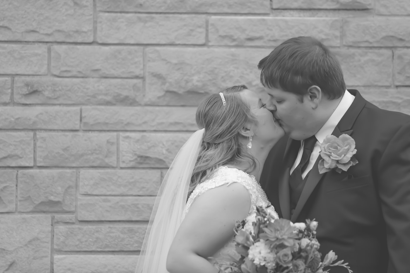 Wedding couple kiss in black and white.