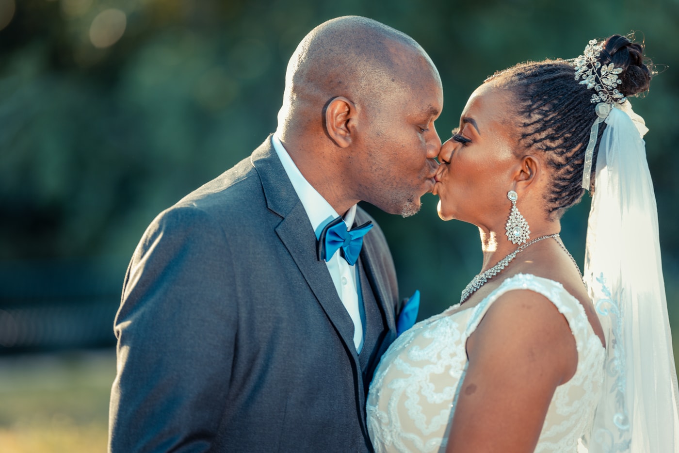 Wedding couple kiss close portrait.