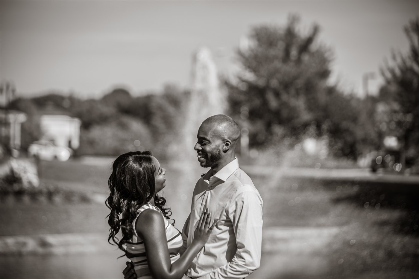 Wedding couple by water in black and white.
