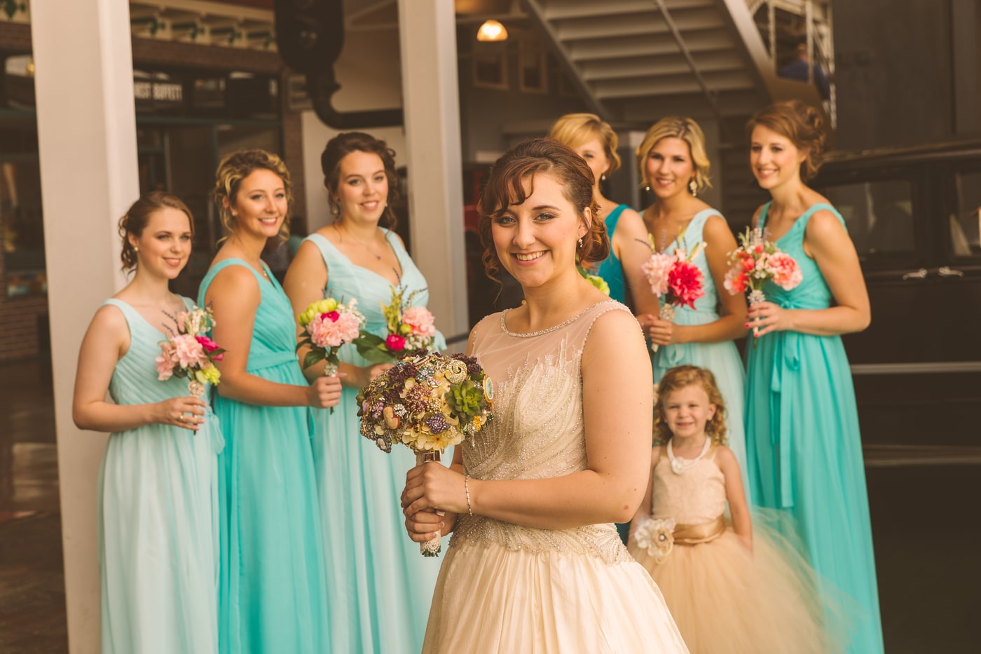 Wedding party portrait with coordinated color and clean spacing.