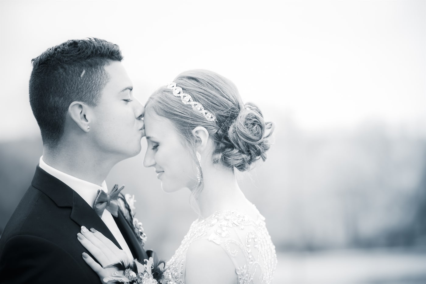 High-key wedding couple portrait.