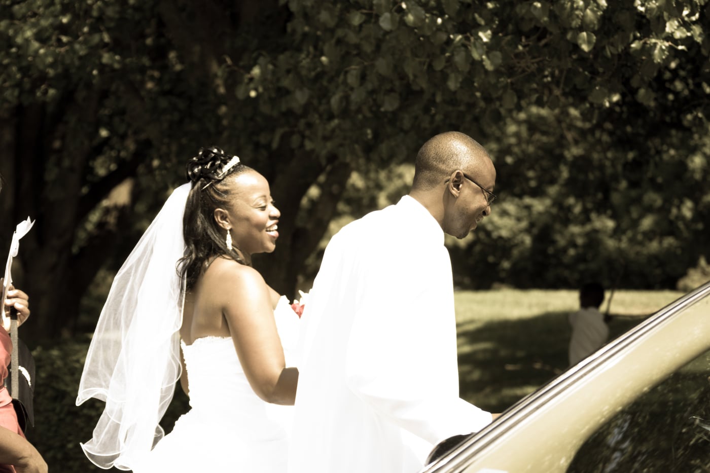 Wedding exit moment with movement, laughter, and documentary connection.